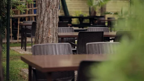 Plastic chairs and plastic tables in the forest café in the open air. Stock Footage 100892586
