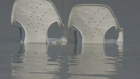 Plastic chairs in dead sea Stock Footage 163079856