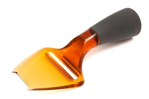 Plastic cheese knife Stock Photos