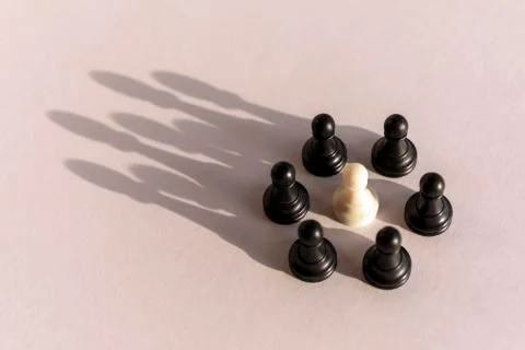 Plastic chess pawn circle with shadow shaped as crown on white background. Te Stock Photos