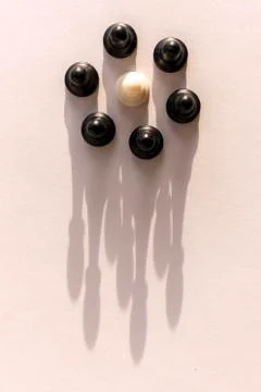 Plastic chess pawn circle with shadow shaped as crown on white background. Te Foto stock