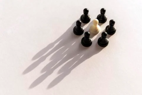 Plastic chess pawn circle with shadow shaped as crown on white background. Te Stock Photos