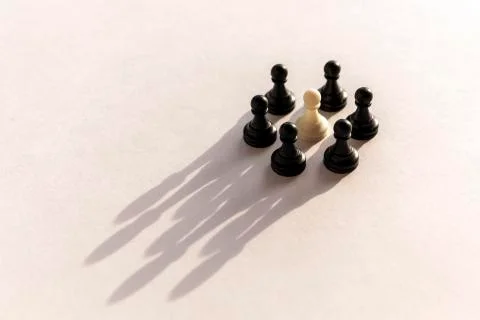 Plastic chess pawn circle with shadow shaped as crown on white background. Te Foto stock