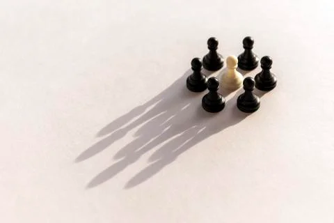 Plastic chess pawn circle with shadow shaped as crown on white background. Te Stock Photos