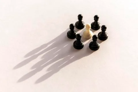 Plastic chess pawn circle with shadow shaped as crown on white background. Te Stock Photos