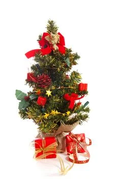 Plastic christmas tree with red presents Foto stock