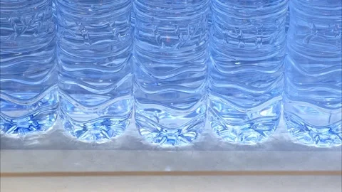 Plastic, clear bottles of water in a row in the supermarket. Stock Footage 306997124