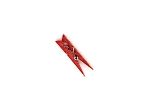 Plastic clothespin. one red plastic clothespin on white background top view Foto stock