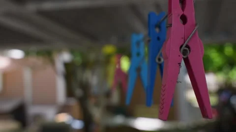 Plastic clothespins closeup on a clothesline Stock Footage 146688053