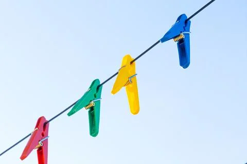 Plastic clothespins in different colors Foto stock