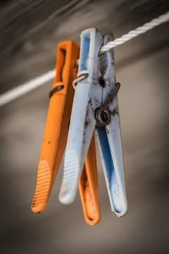 Plastic colored clothes pegs Stock Photos