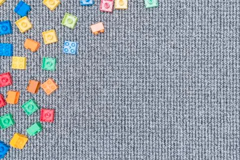 Plastic constructor on the carpet. Stock Photos