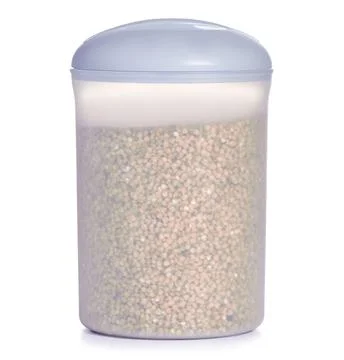 Plastic container of buckwheat Stock Photos