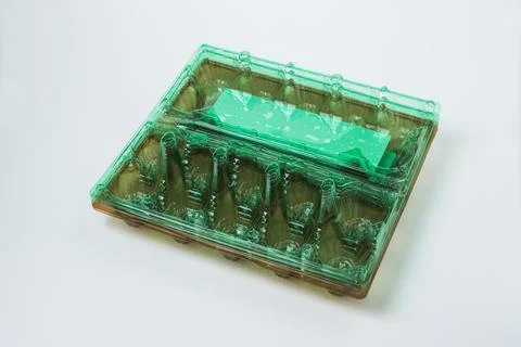 Plastic container for eggs on a white background Stock Photos
