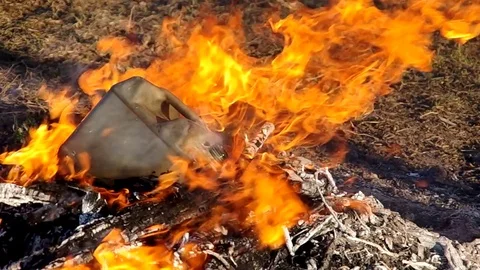 Plastic container in fire Stock Footage 77245948
