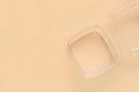 Plastic container for food on beige background, top view Stock Photos