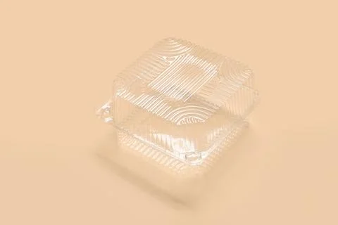 Plastic container for food on beige background Stock Photos