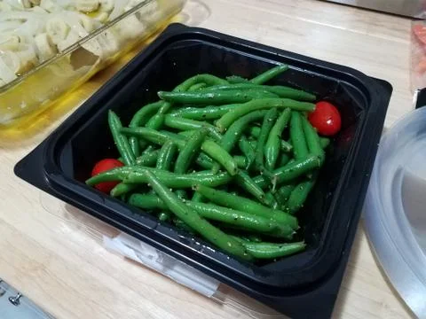 Plastic container with green beans and pepper Stock Photos