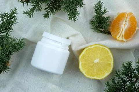 Plastic container with lemon and mandarin slices. Stock Photos