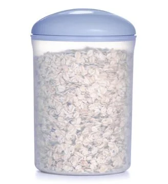 Plastic container of oatmeal Stock Photos