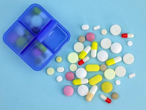 Plastic container for pills top view. Blue pill organize Stock Photos