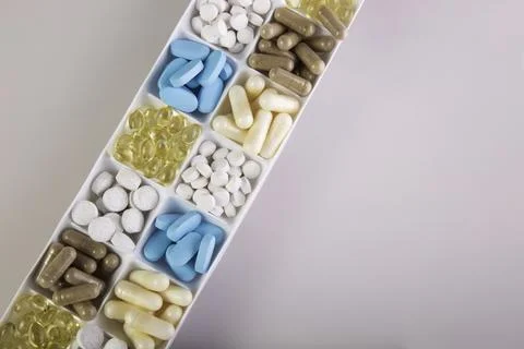 Plastic container with pills on white background 스톡 사진