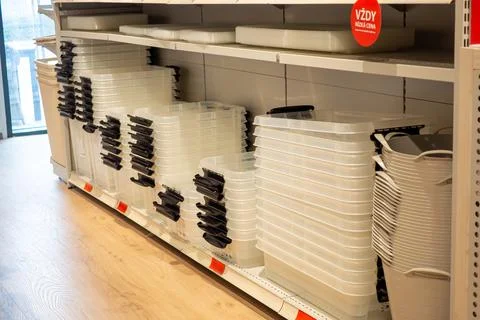 Plastic containers are neatly stacked on store shelves. Brno March 21, 2026 Stock Photos
