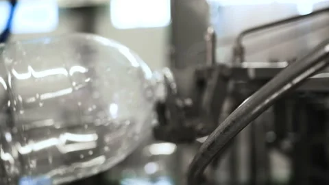 Plastic containers, bottles, go sequentially row along production conveyor line Stock Footage 161821694