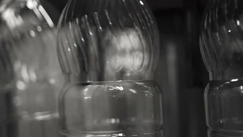 Plastic containers, bottles, go sequentially row along production conveyor line Stock Footage 161824048