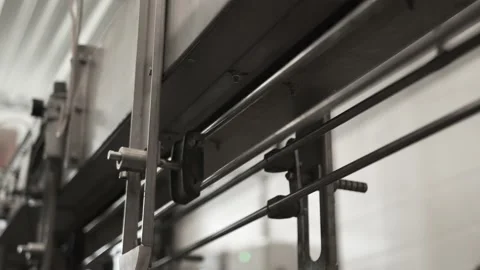 Plastic containers, bottles, go sequentially row along production conveyor line Stock Footage 161830861