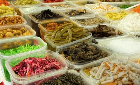 Plastic containers with pickled vegetables. Stock Photos