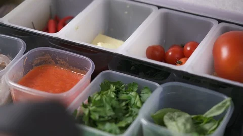 Plastic containers with sauce, parsley, spinach Stock Footage 102165145