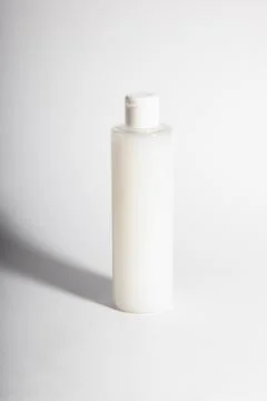 Plastic containers without labels or brand on a white background. Stock Photos