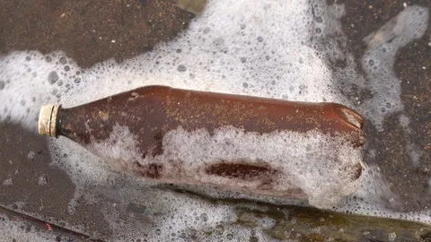Plastic contamination of the aquatic environment. Close-up of a plastic bottle Stock Footage 116996527
