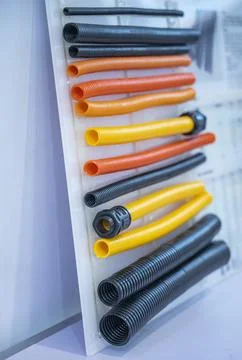 Plastic corrugated pipe is cable coil and is used for protective electric c.. Stock Photos