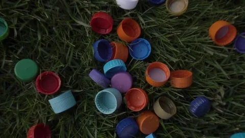 Plastic covers lie on the green grass Vidéo 120089989