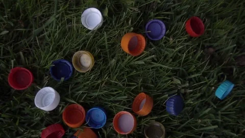 Plastic covers lie on the lawn Vidéo 120089995
