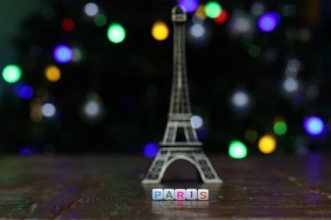 Plastic cubes with the word PARIS with the eiffel tower in the background Stock Photos
