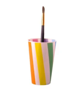 Plastic cup with a brush to paint Stock Photos