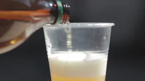 Plastic cup filled with beer Stock Footage 52686392