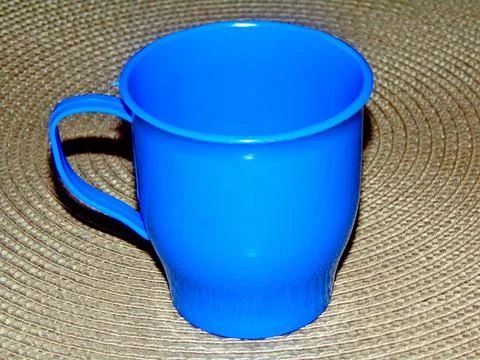 Plastic cup on a gray surface Stock Photos