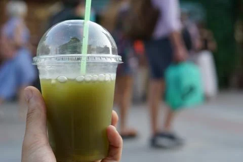 Plastic cup in hand Stock Photos