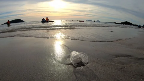 Plastic cup left on the beach. Video stock 100631432