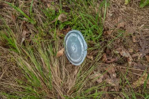 Plastic cup lid on the ground Foto stock
