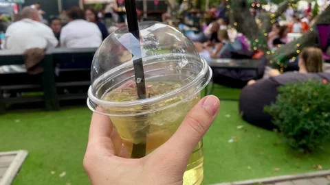 Plastic Cup with Straw at Outdoor Cafe Stock Footage 304544520