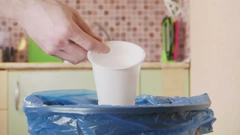 Plastic cup is thrown into the trash bin Stock Footage 155485884