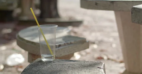 A plastic cup was left on the chair.Garbage is not thrown away properly. Stock Footage 302116002