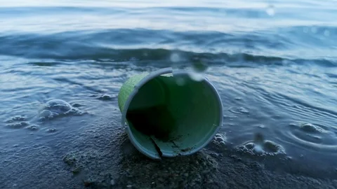 Plastic cups and packages close-up. The concept of environmental protection, eco Stock Footage 111645251