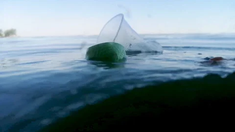Plastic cups and tubes in the bottle. Live macro photography plastic. Perspectiv Stock Footage 111645274