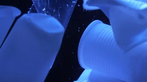 Plastic cups floating in water 4k | Stock Video | Pond5